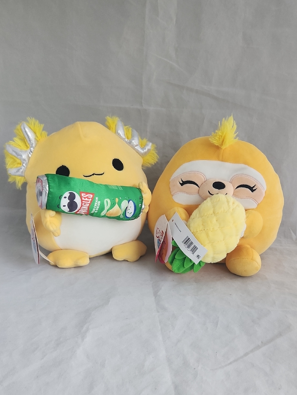 2 Zuru Snackles Plush: Pringles Axolotl "Leon" & Dole Sloth "Sandy" Plush